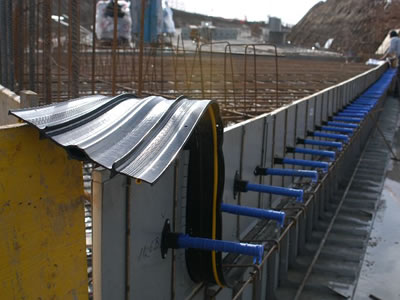 Rubber waterstops are installed in a water reservoir which is under construction.